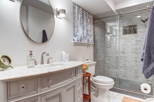 bathroom featuring walk in shower, tile patterned floors, toilet, and vanity