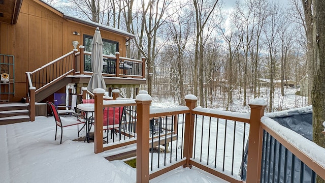 view of snow covered deck