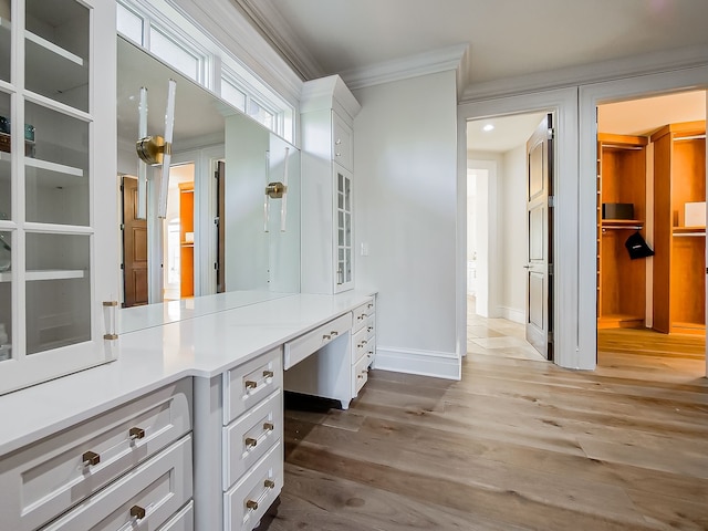 bathroom featuring hardwood / wood-style floors and ornamental molding