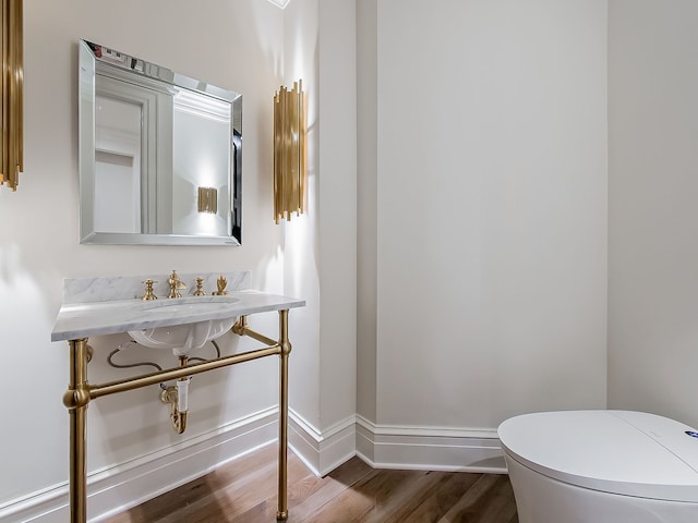 2748 Turtle Lake Dr, Bloomfield Hills, MI 48302 - bathroom featuring wood finished floors, baseboards, and toilet