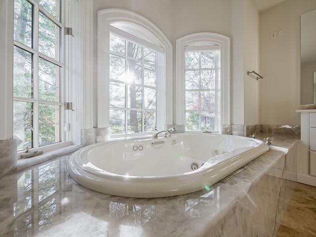 bathroom with tiled tub