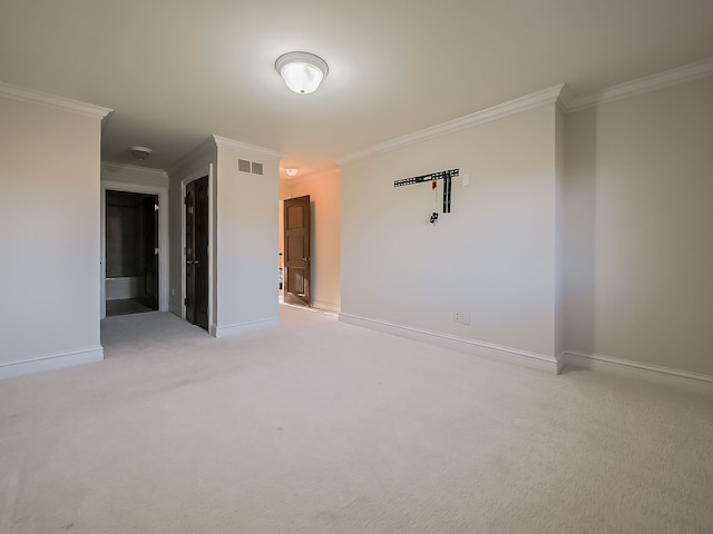 carpeted empty room featuring ornamental molding