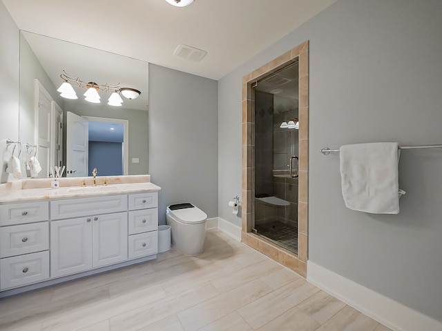 bathroom with hardwood / wood-style flooring, vanity, toilet, and walk in shower