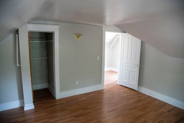 bonus room featuring hardwood / wood-style flooring and lofted ceiling