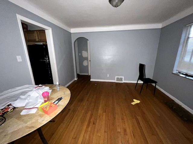 sitting room with dark wood-type flooring