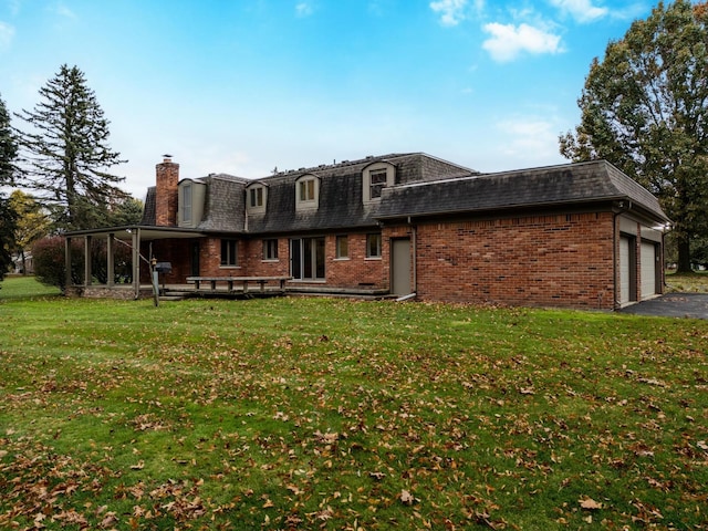 view of front of house with a front yard and a garage