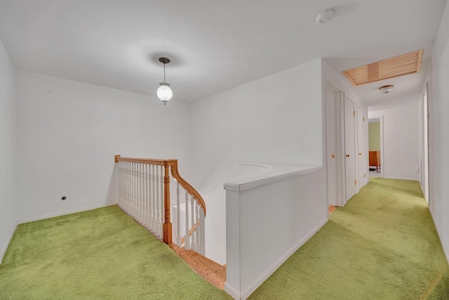 hallway with light colored carpet