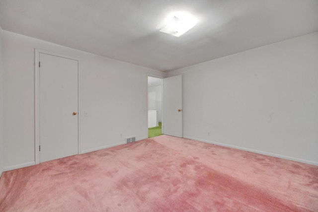 spare room featuring carpet floors