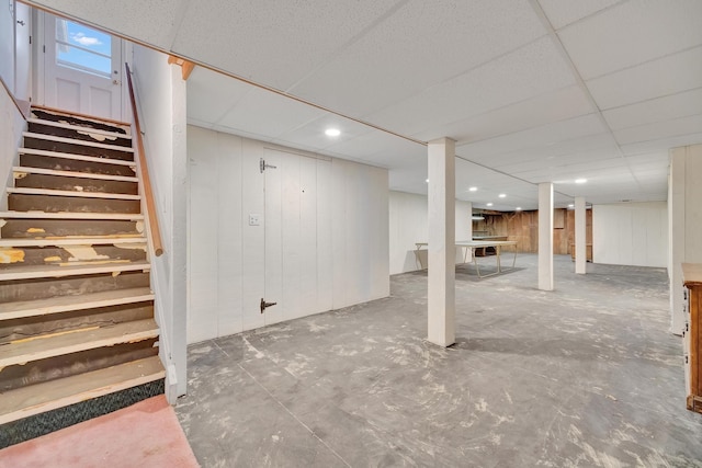 basement featuring a drop ceiling