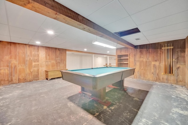 playroom with a paneled ceiling, wooden walls, concrete flooring, and billiards