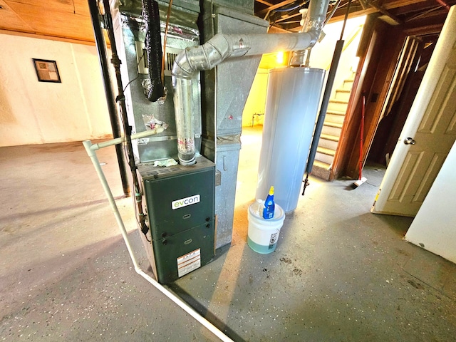 utility room with heating unit and gas water heater