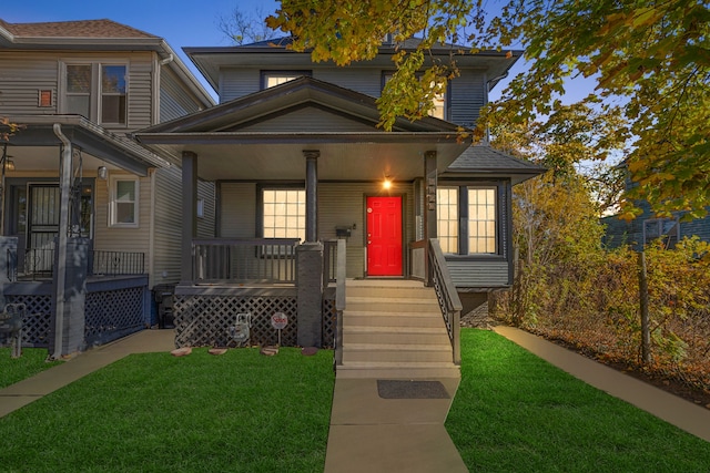 view of front of property featuring a front yard and a porch