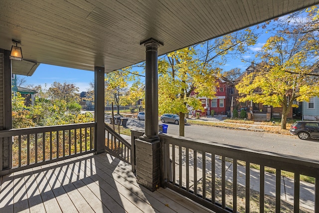 wooden terrace with a porch