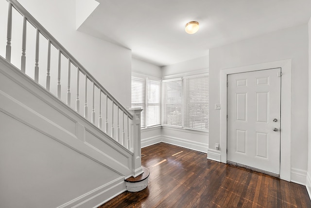 foyer with dark wood-type flooring