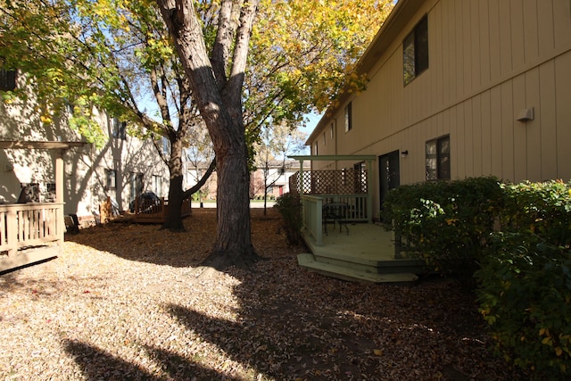 view of yard featuring a wooden deck