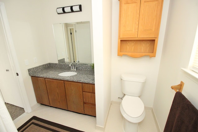 40831 Highpointe Dr, Clinton Township, MI 48038 - bathroom with toilet, vanity, baseboards, and tile patterned floors