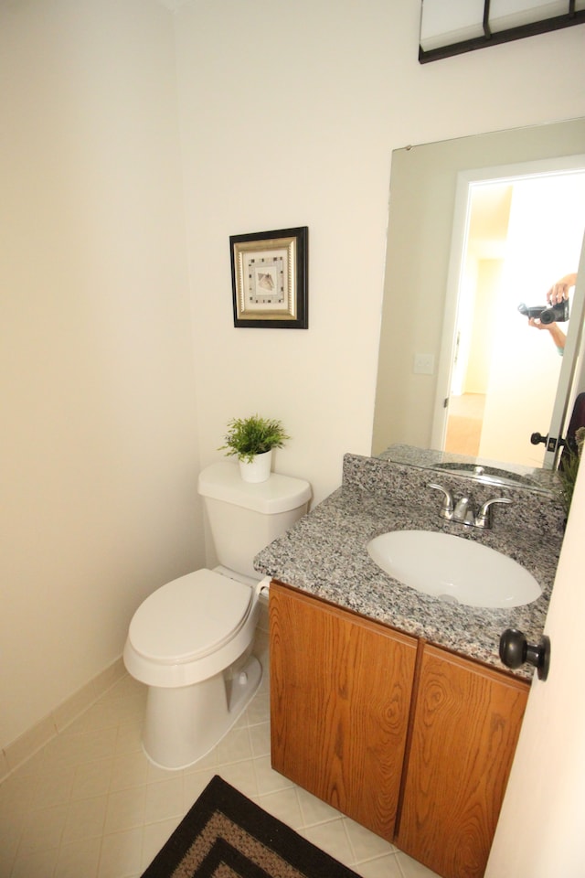 40831 Highpointe Dr, Clinton Township, MI 48038 - half bath with vanity, toilet, tile patterned floors, and baseboards