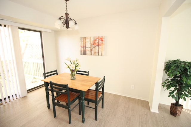 40831 Highpointe Dr, Clinton Township, MI 48038 - dining area with light wood finished floors, a chandelier, and baseboards