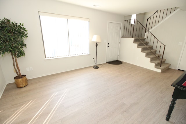 40831 Highpointe Dr, Clinton Township, MI 48038 - entryway with wood finished floors, stairs, and baseboards