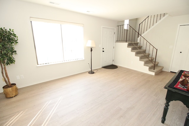 40831 Highpointe Dr, Clinton Township, MI 48038 - entryway with wood finished floors, stairway, and baseboards