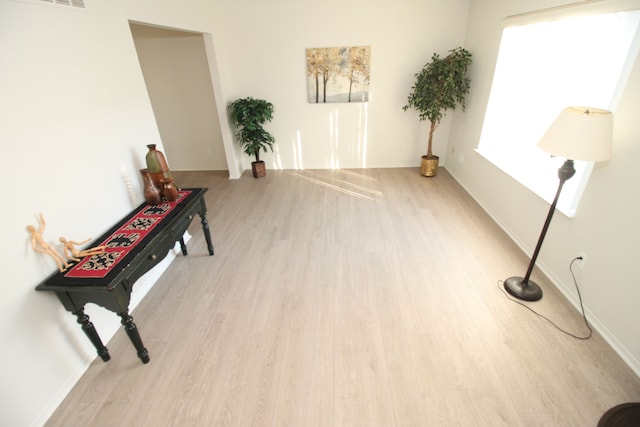 40831 Highpointe Dr, Clinton Township, MI 48038 - sitting room with wood finished floors and baseboards