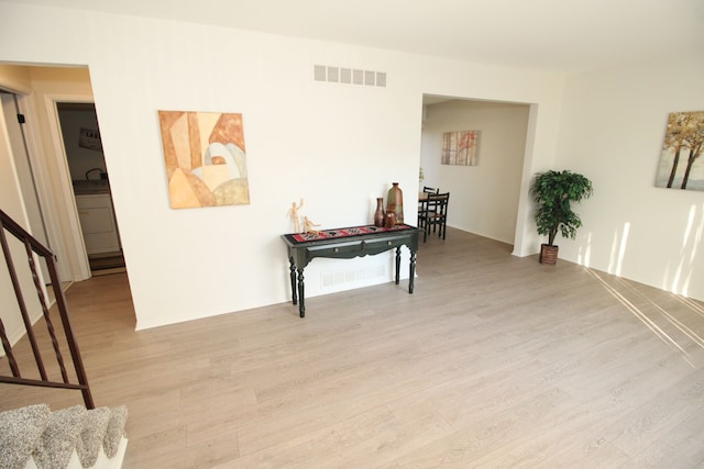 40831 Highpointe Dr, Clinton Township, MI 48038 - hallway with wood finished floors, stairs, and baseboards