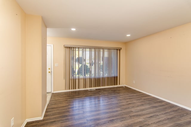 empty room featuring dark hardwood / wood-style floors