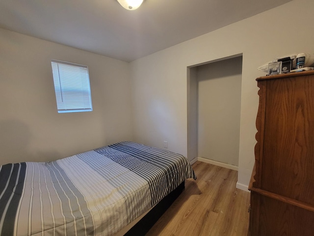 bedroom with light hardwood / wood-style flooring