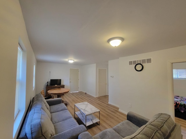 living room with light hardwood / wood-style flooring