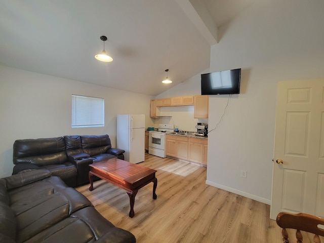 living room with sink, light hardwood / wood-style flooring, and vaulted ceiling