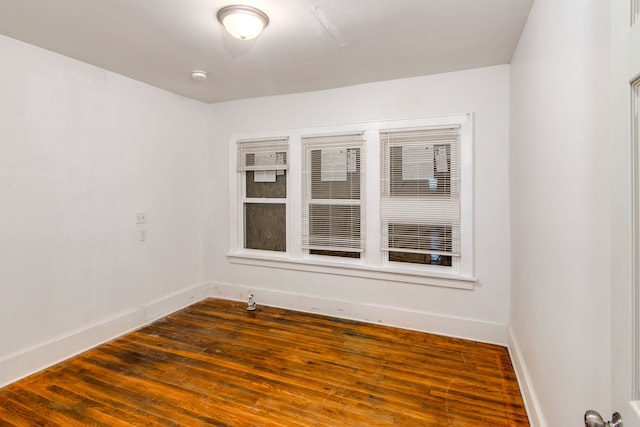 empty room featuring hardwood / wood-style flooring