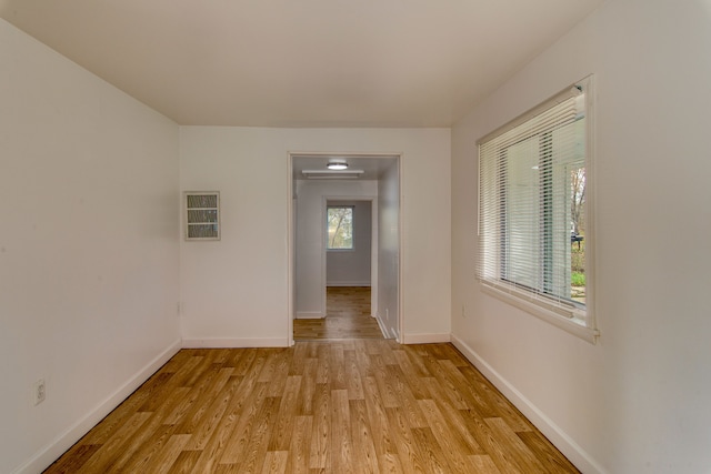 corridor featuring light hardwood / wood-style flooring