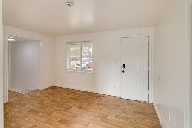 foyer with light wood-type flooring