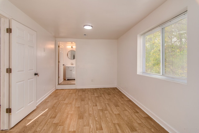 interior space with light hardwood / wood-style flooring and sink