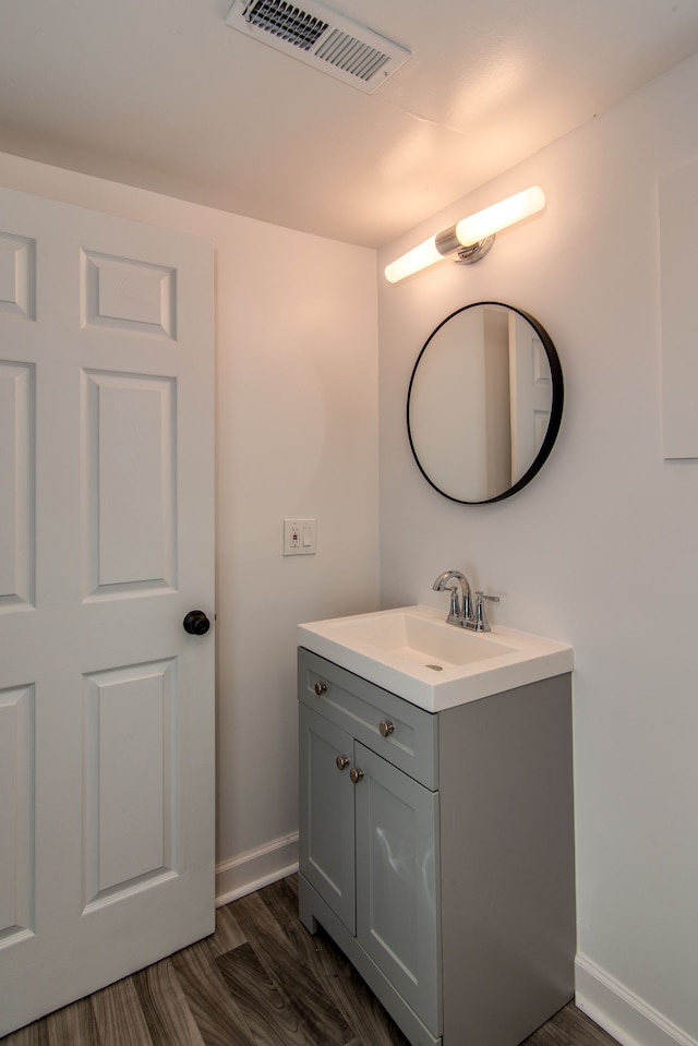 bathroom featuring vanity and wood-type flooring