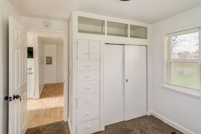 unfurnished bedroom with hardwood / wood-style flooring and a closet