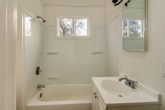 bathroom featuring shower / washtub combination, vanity, and a healthy amount of sunlight