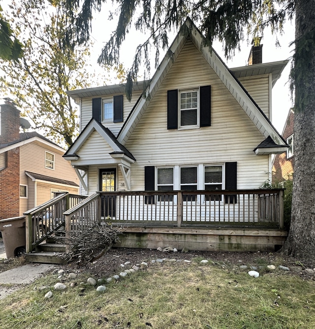 rear view of property with a yard