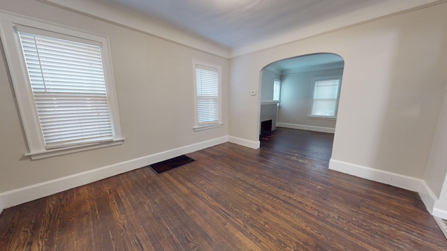 spare room with dark hardwood / wood-style flooring