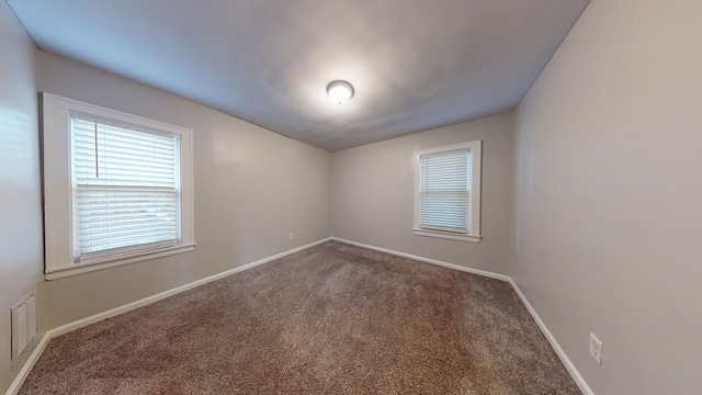 empty room featuring carpet