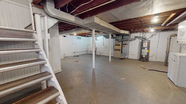 basement featuring gas water heater, washer / clothes dryer, and heating unit