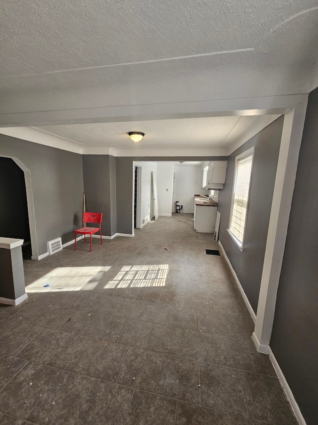 interior space with a textured ceiling