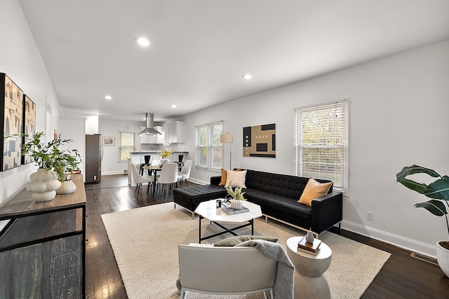 living room with dark wood-type flooring