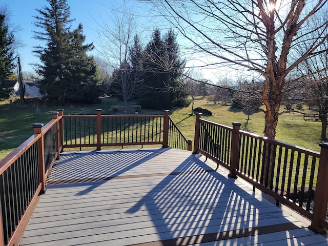 wooden terrace with a lawn