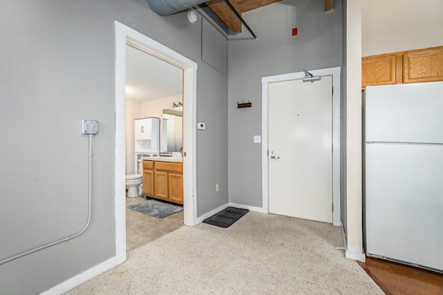 interior space featuring vanity and toilet