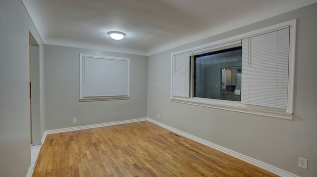 unfurnished room featuring light wood-type flooring