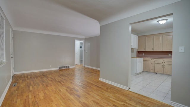 unfurnished living room with light hardwood / wood-style flooring