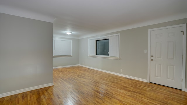 spare room with light wood-type flooring