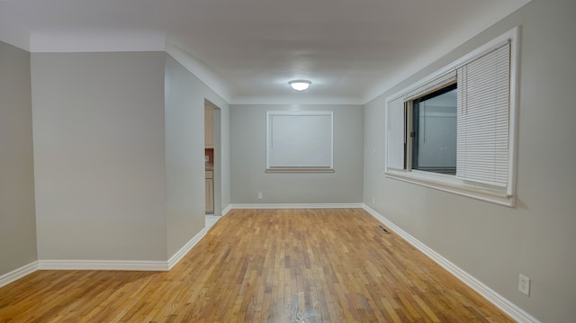 spare room with light hardwood / wood-style floors