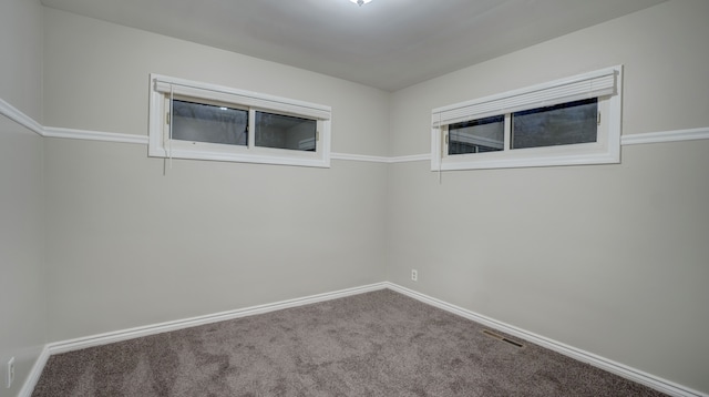 spare room featuring carpet flooring